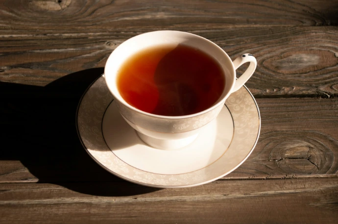 white ceramic teacup on white ceramic saucer